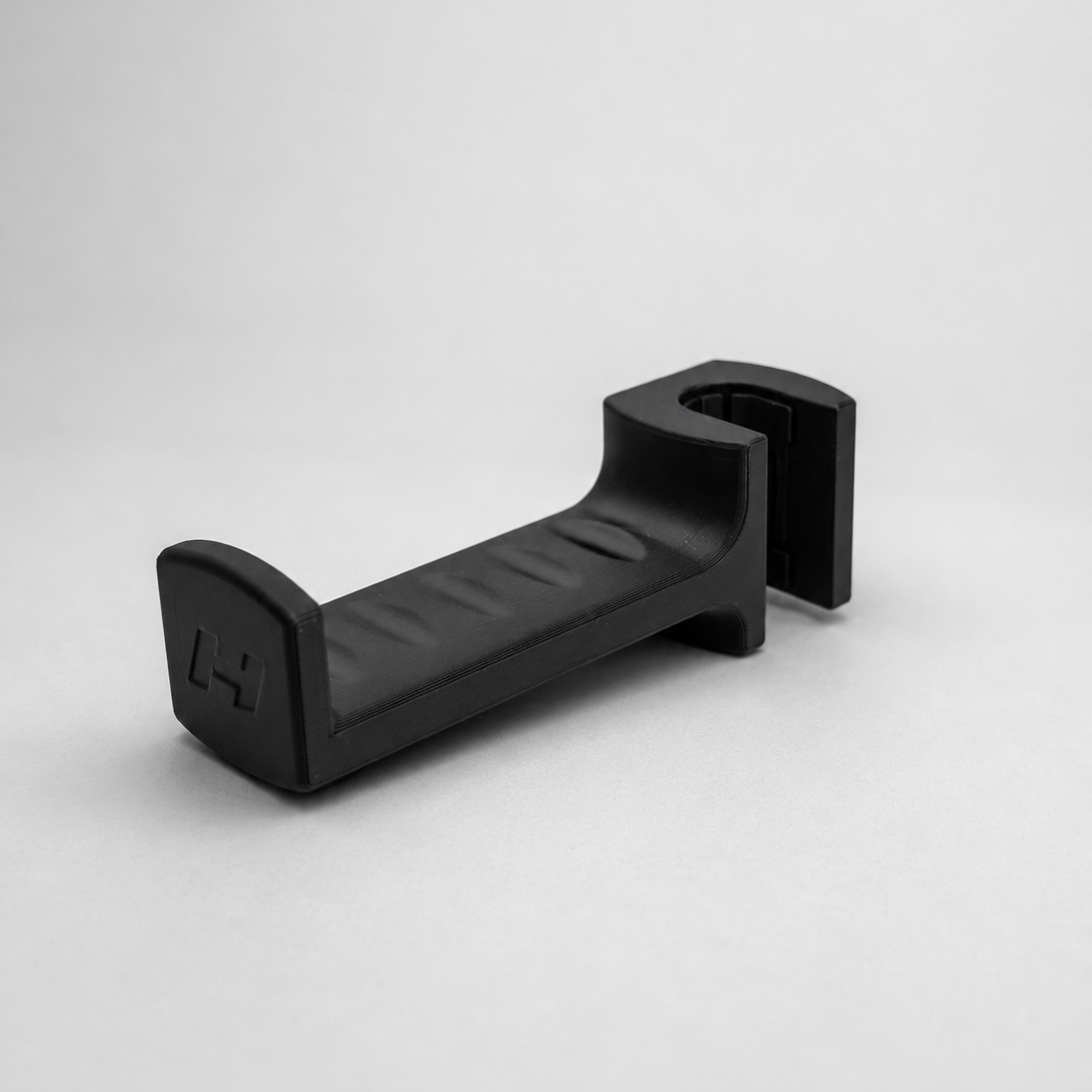 Black headrest hook on a white background 