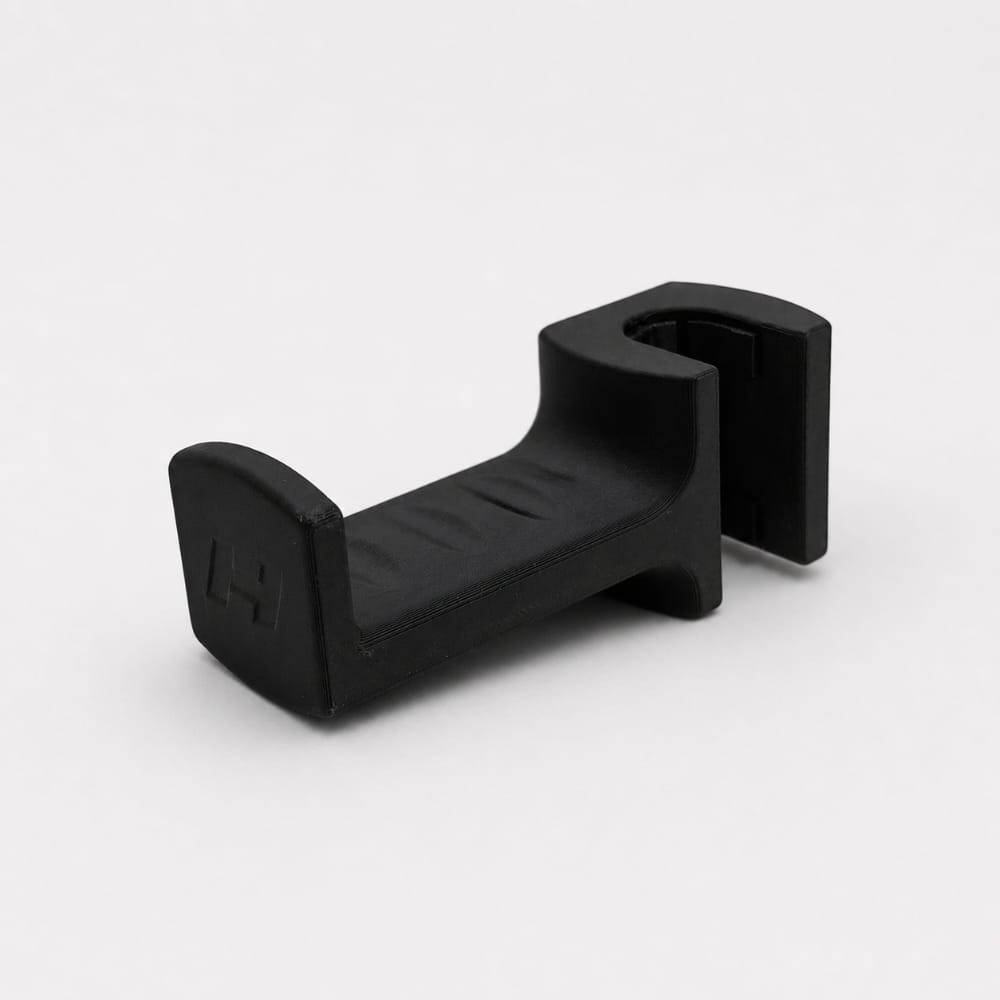 Black plastic bracket on a white background